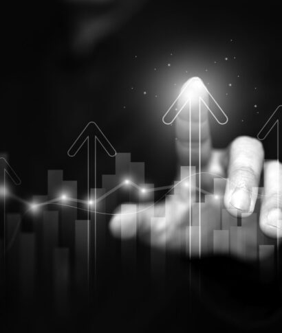 Finance, business, investment, or economy growing graph concept. A man tapping on top of an arrow, analyzed data, as it rising up high. The chart and arrows represening the growth and increase.